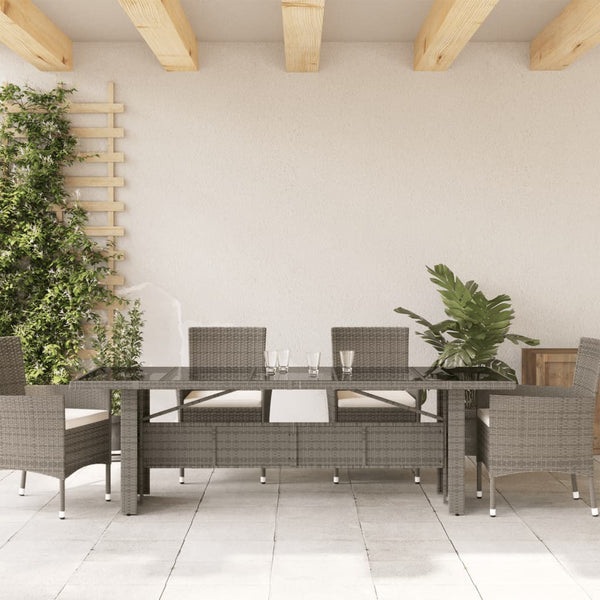 Mesa de jardim com tampo de vidro 240x90x75 cm vime PE cinzento